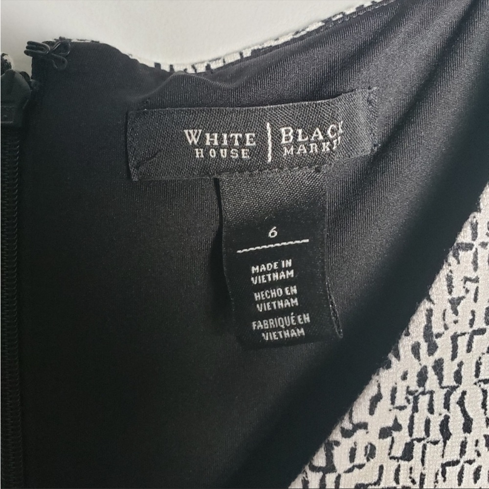 Beautiful dress perfect for work attire or social gathering. No rips or stains.